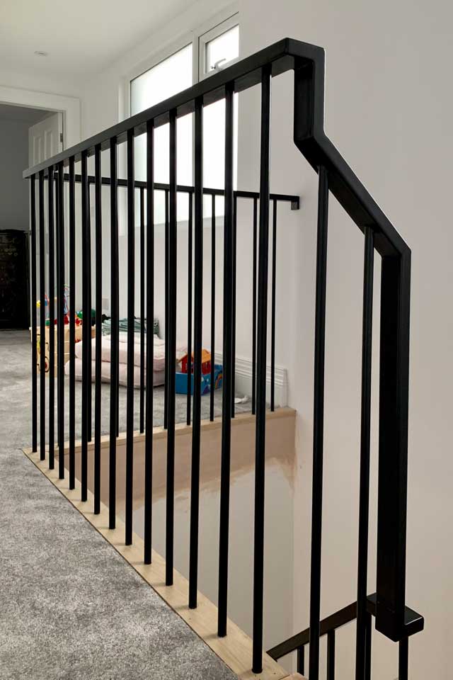 Modern Wrought Iron Staircase Handrails and Landing