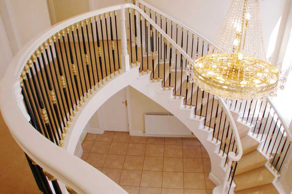 Traditional Style Staircase with Decorative Metal Spindles